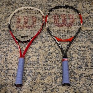 A Pair Of Wilson Tennis Rackets.